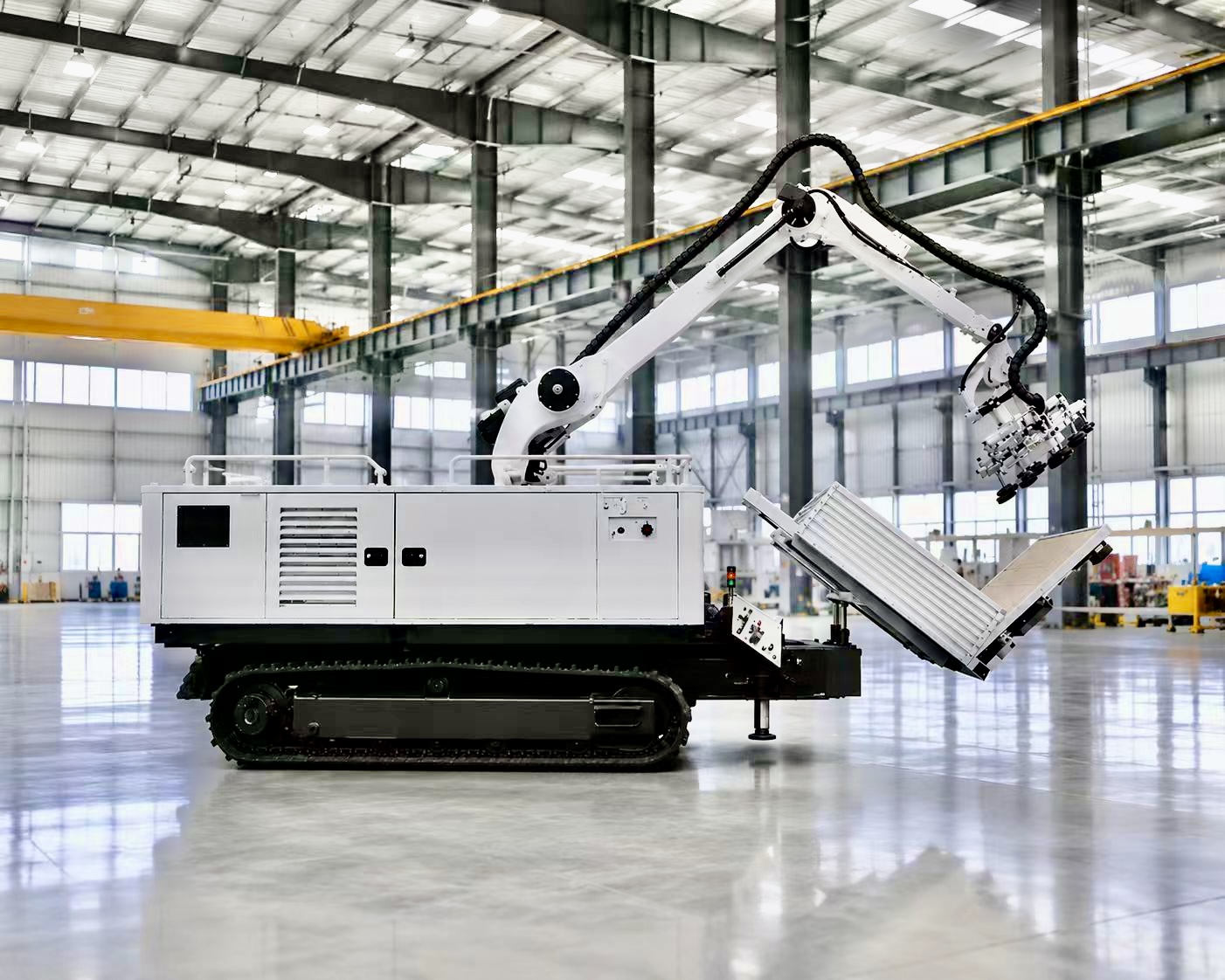 Tracked solar-field installation robot with articulated arm