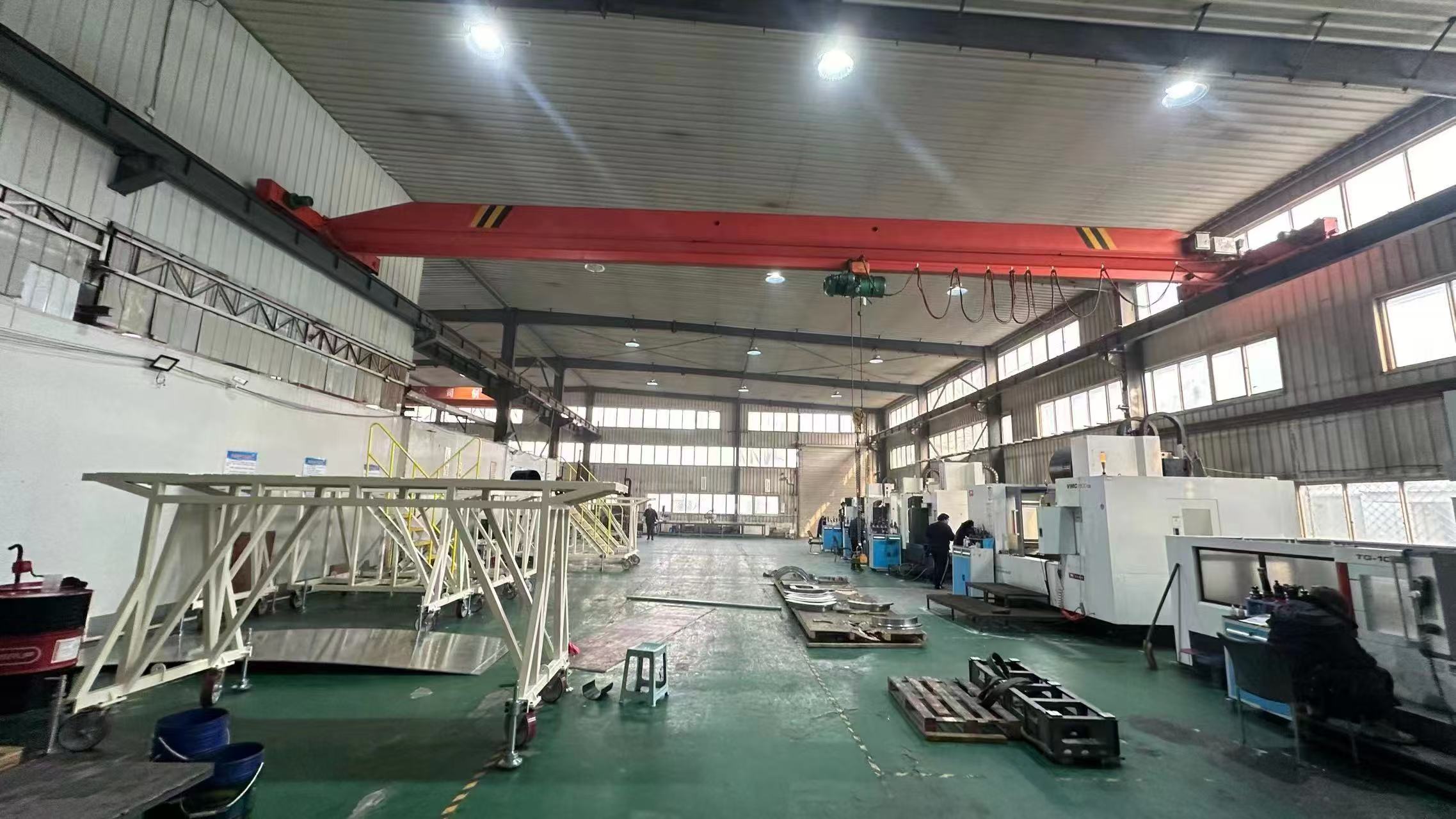 Real workshop with machining equipment, lifting capacity and fabricated assemblies
